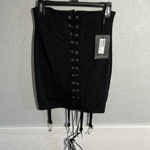 NWT. Pretty Little Thing black stretch lace up mini skirt with suspenders. New